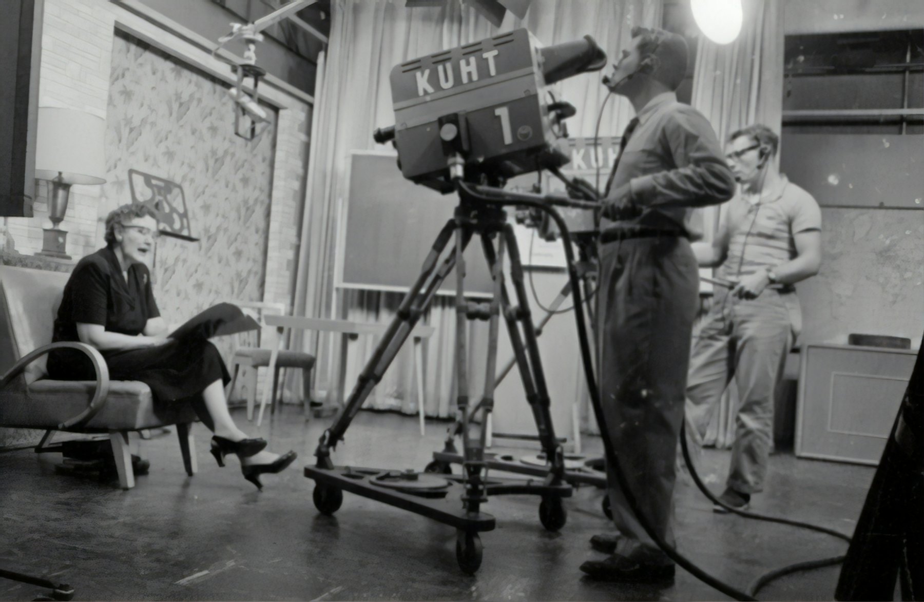 A television crew working a studio camera in the early years of broadcast